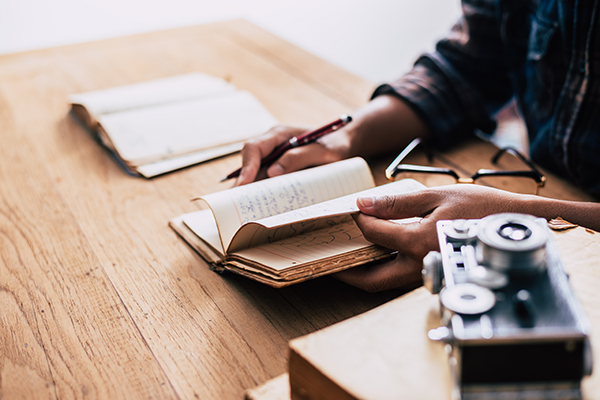 home office desk background, Desk musicians, hand holding pencil